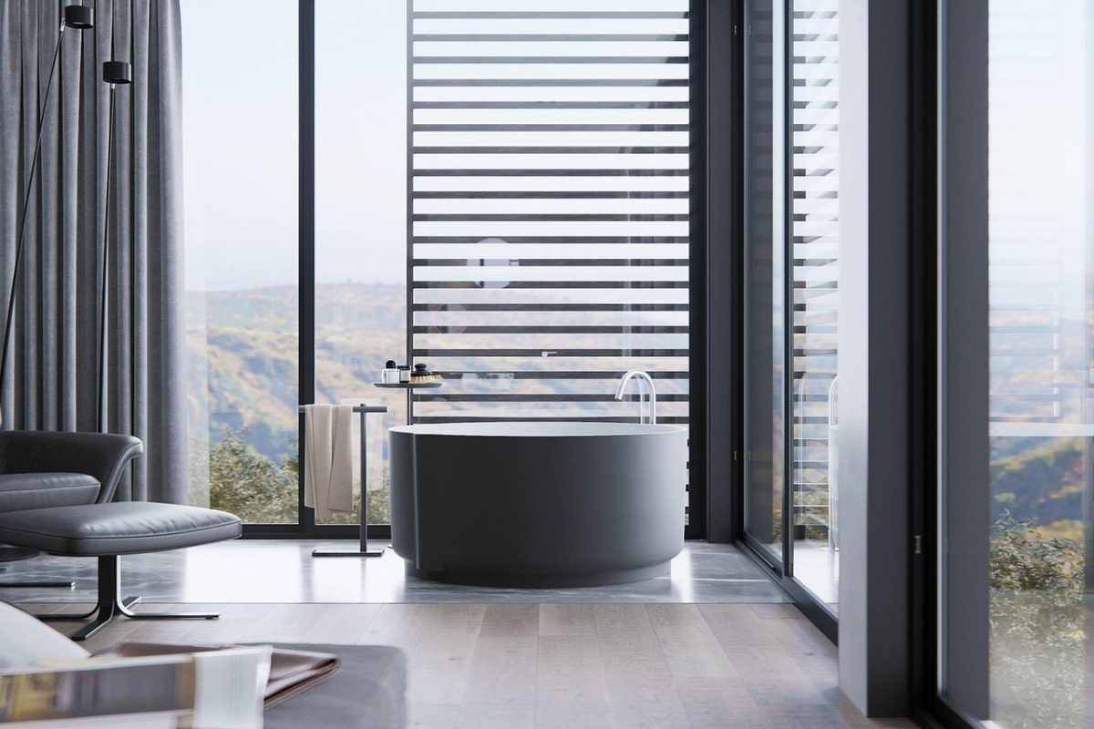A domestic bathroom with a bathtub, basin and tiled surfaces