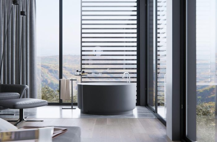 A domestic bathroom with a bathtub, basin and tiled surfaces