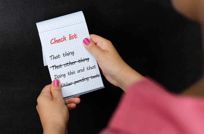 A printed checklist on a notepad, ready to be carried around the house