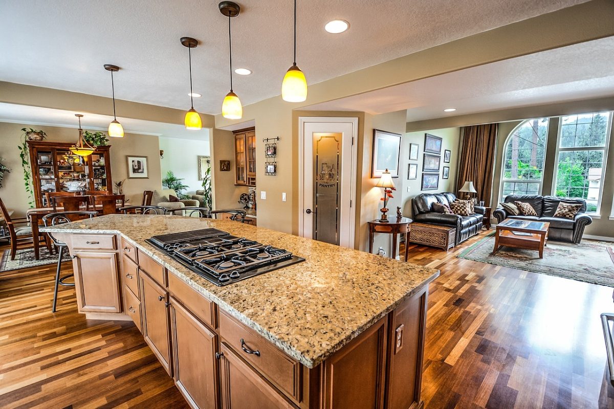 A kitchen with counters and wall cabinets at typical reach heights