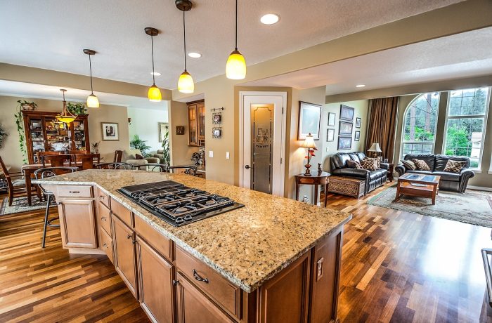 A kitchen with counters and wall cabinets at typical reach heights