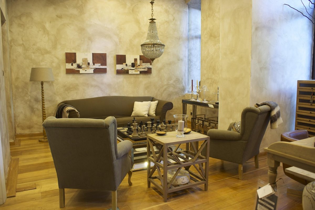 A living room with an armchair beside a low table
