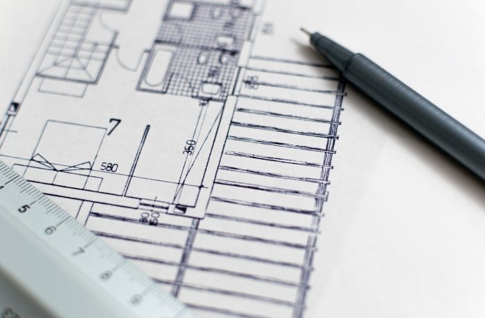 A floor plan drawing with a pencil, used when planning home changes in advance