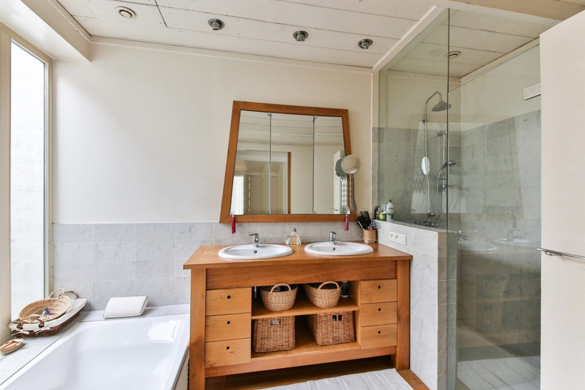 A compact bathroom where the shower and bathtub leave little clear floor space