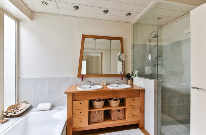 A compact bathroom where the shower and bathtub leave little clear floor space